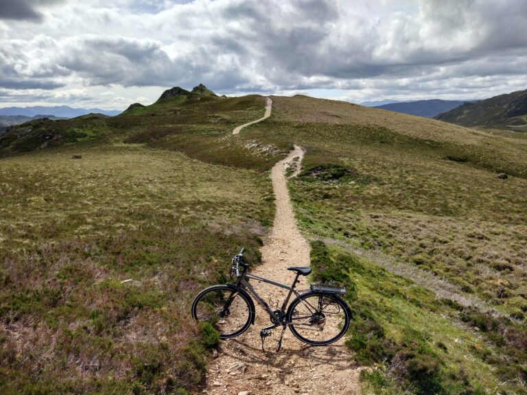 A bike on a cycle path high in the mountains of Scotland
